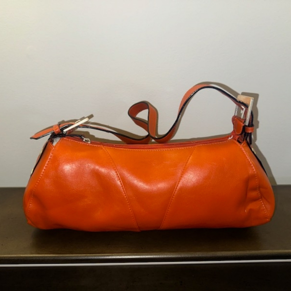 Brick orange heels with matching handbag.
